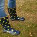 A Michigan fan sports rain boots while tailgating before the game against Illinois on Saturday. Daniel Brenner I AnnArbor.com